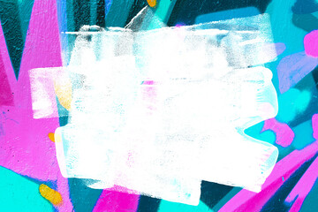 Closeup of colorful teal, pink, blue urban wall texture with white white paint stroke. Modern...