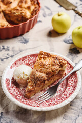 Classic American apple pie served with ice cream on linen tablecloth. Homemade american autumn dessert: sliced apple pie (tart) with cinnamon. Selective focus - 539746918