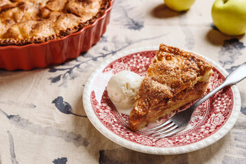 Classic American apple pie served with ice cream on linen tablecloth. Homemade american autumn dessert: sliced apple pie (tart) with cinnamon. Selective focus - 539746963