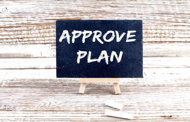 APPROVE PLAN text on the Miniature chalkboard on wooden background