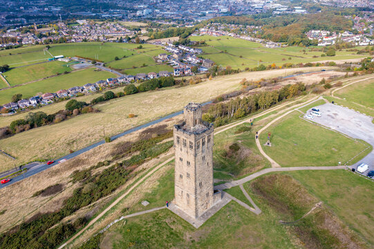 Aerial drone photo of the famous Castle Hill, a scheduled ancient monument in Almondbury overlooking Huddersfield in the Metropolitan Borough of Kirklees, West Yorkshire, England in the autumn time.
