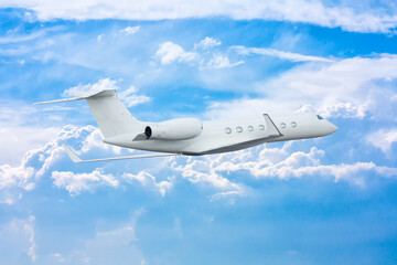 White modern luxury private jet flies in the sky