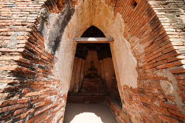 Ruins of pagodas and monks in Wat Khai Watthanaram, Ayutthaya, Thailand that were destroyed by...