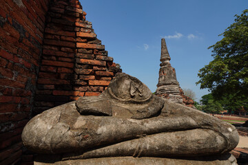 Ruins of pagodas and monks in Wat Khai Watthanaram, Ayutthaya, Thailand that were destroyed by...