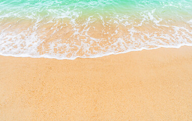 Fototapeta na wymiar sand beach background with waves