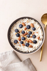 Oatmeal with blueberries, almonds and honey. Healthy food. Vegetarian food. Breakfast.