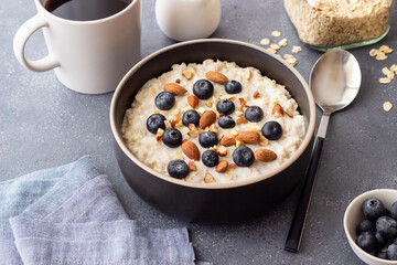 Oatmeal with blueberries, almonds and honey. Healthy food. Vegetarian food. Breakfast.