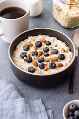 Oatmeal with blueberries, almonds and honey. Healthy food. Vegetarian food. Breakfast.