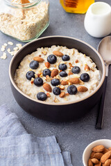Oatmeal with blueberries, almonds and honey. Healthy food. Vegetarian food. Breakfast.