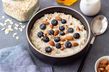 Oatmeal with blueberries, almonds and honey. Healthy food. Vegetarian food. Breakfast.