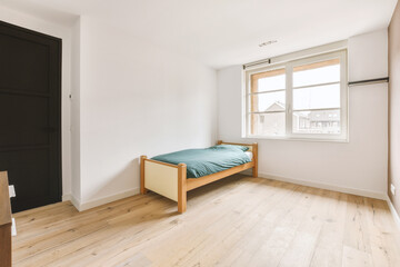 Bedroom with single bed near window