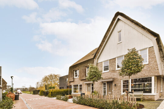 House facade against surrounded by plants in suburb