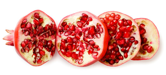 Pomegranate cut into pieces close-up on a white background. top view