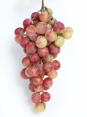 Red fresh grapes isolated on white background