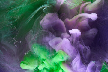 Green purple smoke abstract background, acrylic paint underwater explosion