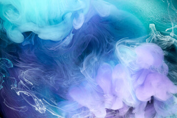 Blue multicolored smoke abstract background, acrylic paint underwater explosion