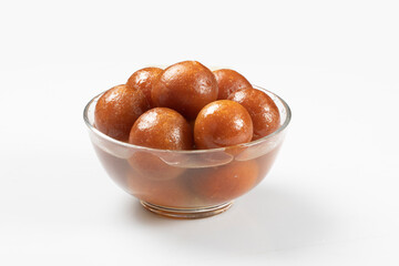 Gulab Jamun with almond and saffron served in white bowl. Indian sweet Gulab jamun closeup view. Isolated In White Background