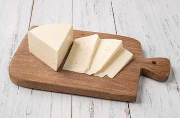 Artisanal fresh Canastra cheese with over wooden board