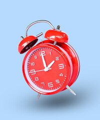 remote image of The red alarm clock is set to 2:00 a.m. a blue background.