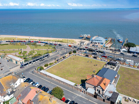 Fleetwood, Lancashire, United Kingdom. 27th August 2022. Two Blackpool Trams arrive and depart at Fleetwood Ferry Port as the Knott End Ferry arrives Fleetwood.