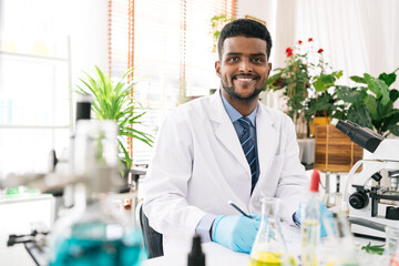 Portraits of a diversity black scientist smile and look at the camera in a research laboratory....