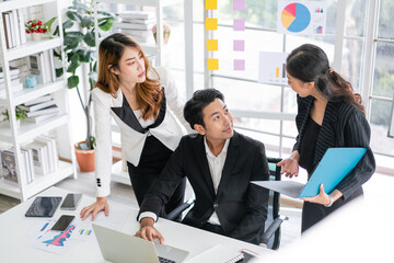 Professional Asian business adviser meeting to analyze and discuss the strategy of financial support of a tech company. Partnership start-up consultant, Indoor business client consultation concept.