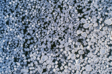 Frozen ice on as a background, a bird's-eye view. Textured surface