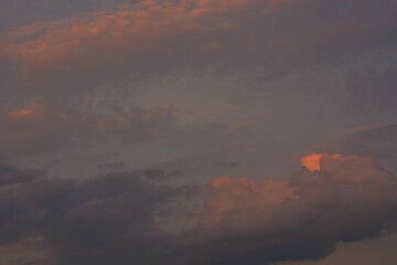 Colorful, evening sky in the rays of an autumn sunset.