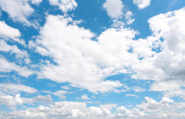 Fototapeta na wymiar white cirrus, feathery clouds against spring bright blue cloudy sky on sunny day in England