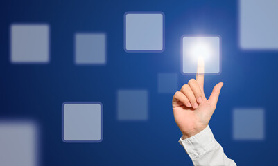 hand pushing a button on a touch screen interface