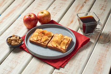 Sweet sandwich with peanut butter and apple. Healthy vegetarian dessert.