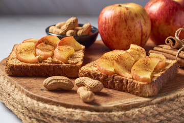 Toasted bread with peanut butter and apple. Quick and healthy breakfast ideas.