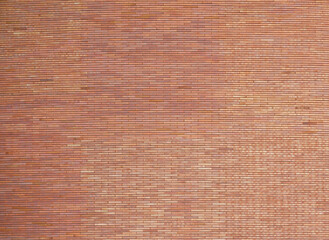 orange brown old brick stack off wall panel exterior design abstract background.for construction material backdrop,vintage or retro wallpaper design.