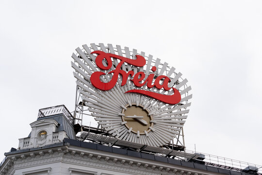 Oslo, Norway - October 15, 2022: Freia clock at Egertorget square in downtown Oslo, Norway. Freia is a Norwegian chocolate sweets manufacturing company.

