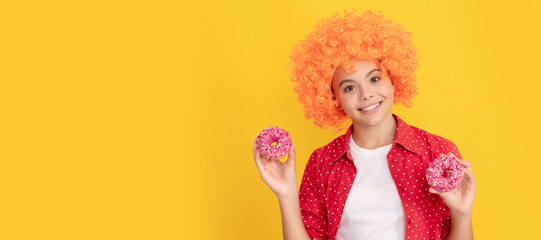 baked goods. sweet tooth. childhood happiness. yummy. happy nice child hold donut. Teenager child with sweets, poster banner header, copy space.