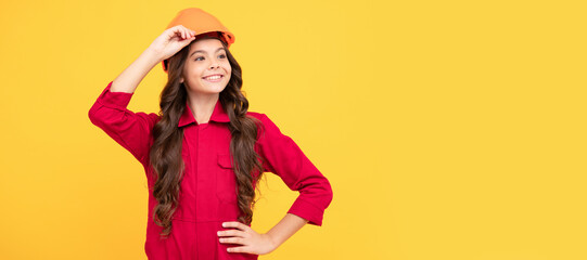 cheerful child girl in protective hard hat, labourer. Child builder in helmet horizontal poster design. Banner header, copy space.