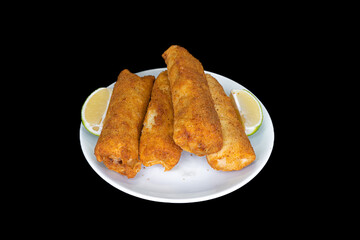 Fried stuffed chicken in a white plate on a black background