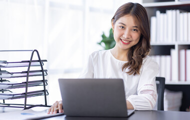 Happiness Entrepreneur beautiful business asian young woman working with laptop at workplace, Small Business Startup, online banking tax, accounting, financial concept.