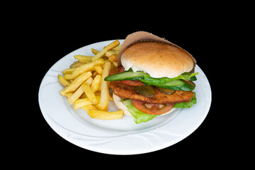 Chicken burger in a white plate on a black background