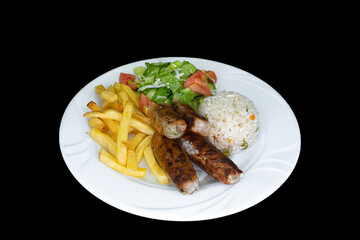 Chicken Sheftali Kebab in a white plate on a black background