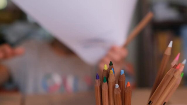 children drawing writing with colored pencils at home concept education at home back to school childhood education