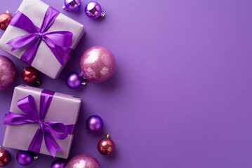 Christmas Day concept. Top view photo of lilac gift boxes with ribbon bows pink and purple baubles...