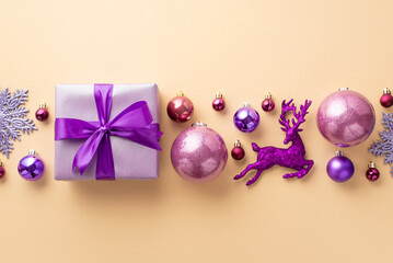 New Year celebration concept. Top view photo of big lilac present box with ribbon bow pink violet baubles snowflake and reindeer ornaments on isolated pastel beige background