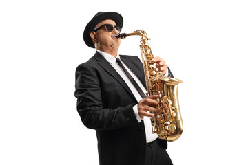 Mature man with sunglasses playing a saxophone