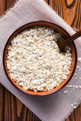 Dish of oatmeal with a spoon on a napkin
