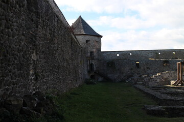 Obraz premium Bzovik, fortified monastery with church in the shout of central Slovakia