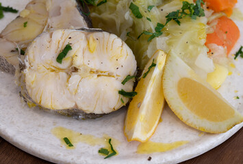 Cooked Hake with Boiled Potatoes and Eggs, close-up view and ready to eat, Braga, Portugal.
