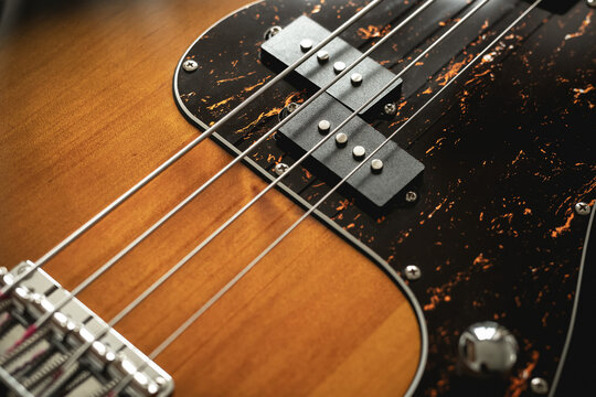 Bass guitar close up. Music wallpaper