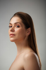 Beauty style portrait of young woman with bare shoulders. Isolated studio advertising portrait.