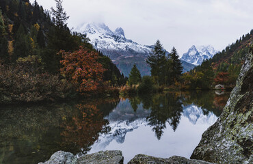 reflection in mountain lake with tent wildcamping